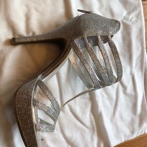 Sexy high heels in glittery silver . Size 7 1/2